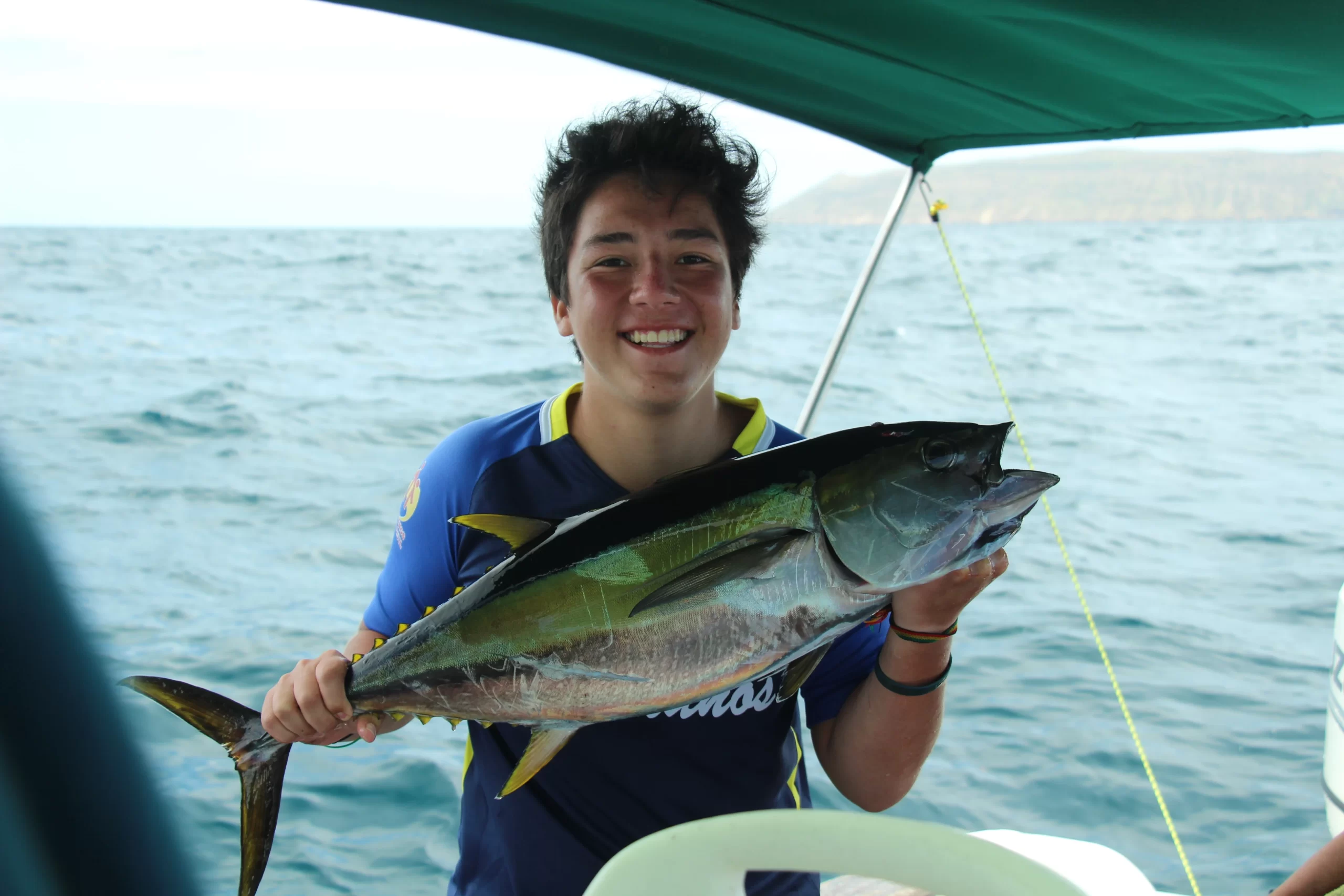 Boy with Tuna that he fished at Tortuga Island Isabela
