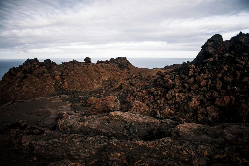 Explore the rugged volcanic terrain of Bartolome Island in the Galapagos, captured in dramatic detail.